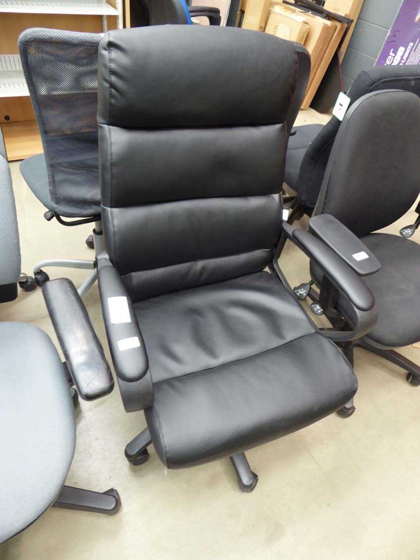 Black high backed swivel armchair