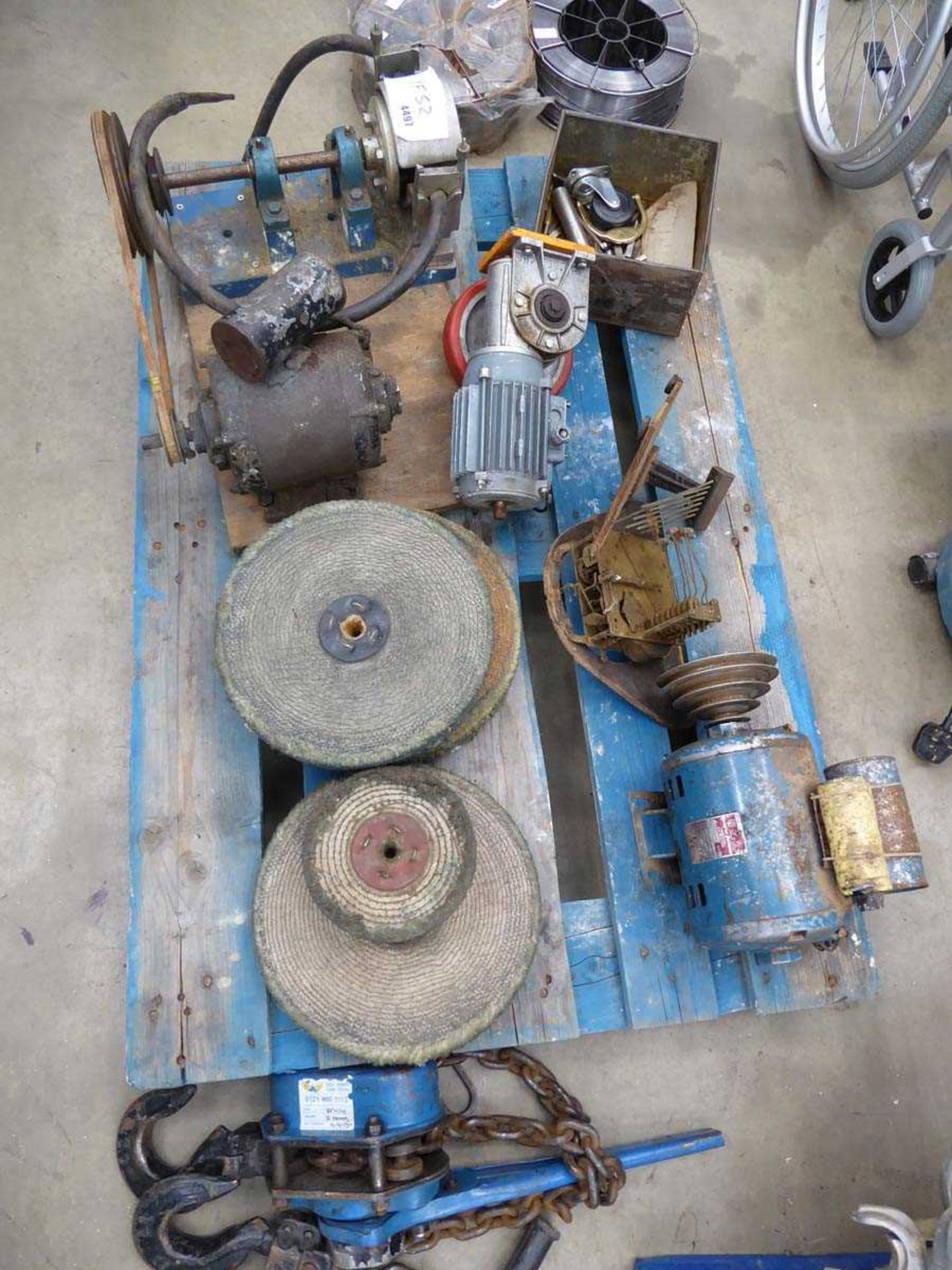 Pallet containing machine parts including electric motors, polishing heads and other parts