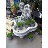 Large cherub and fish style water fountain