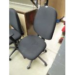 Black swivel armchair