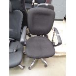 Black cloth swivel armchair