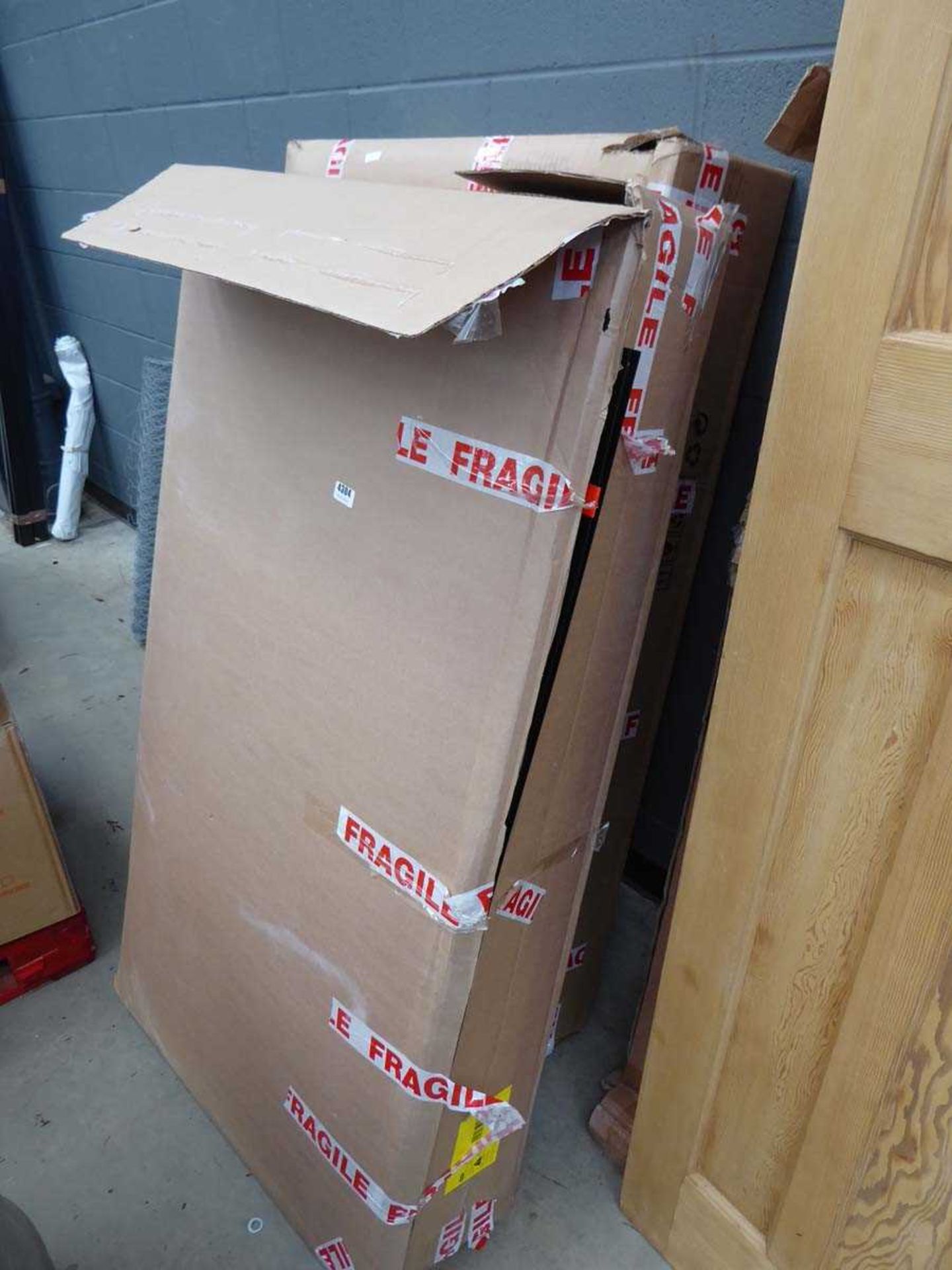 Two boxes containing shed parts