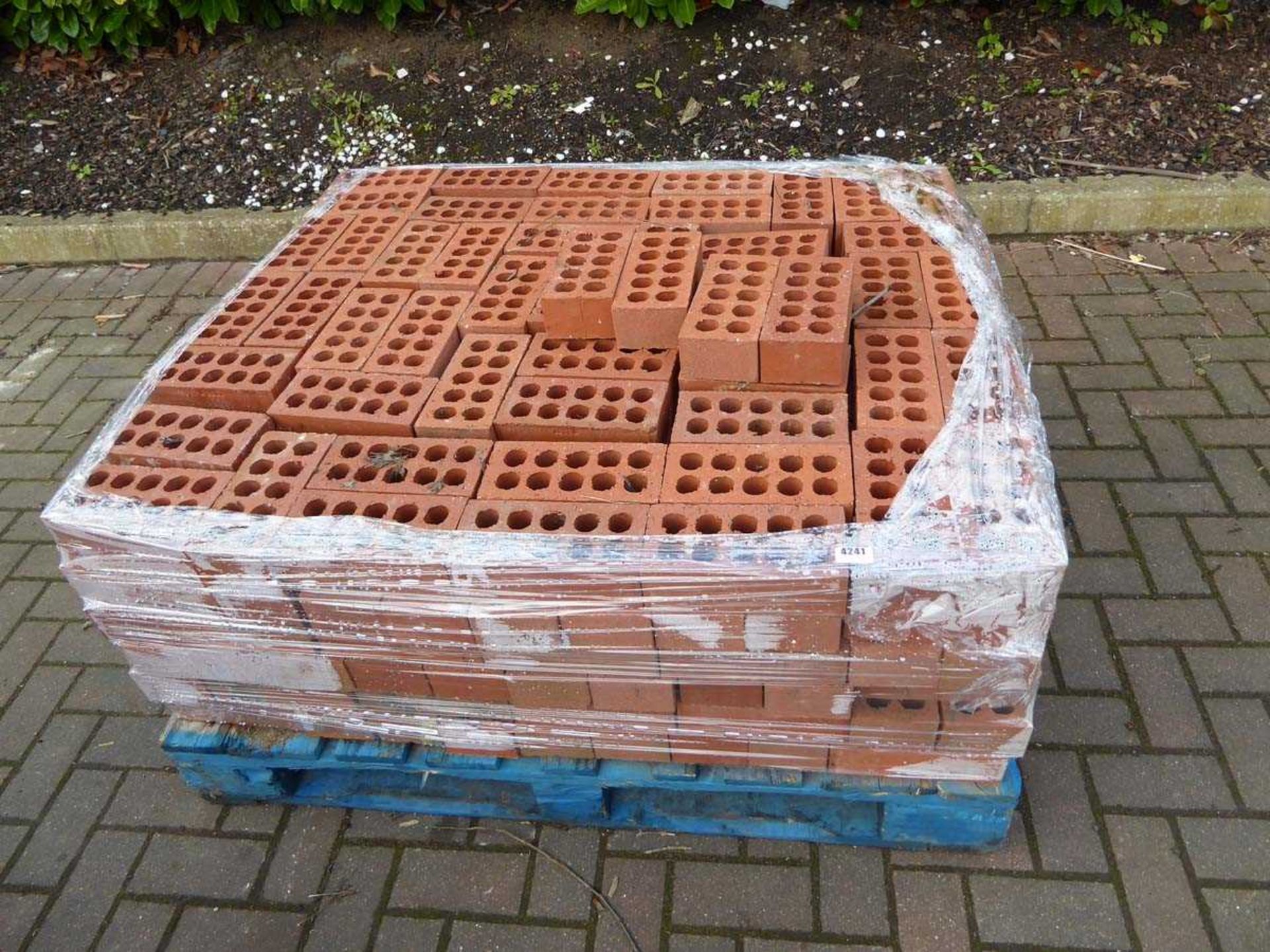 Pallet of red bricks