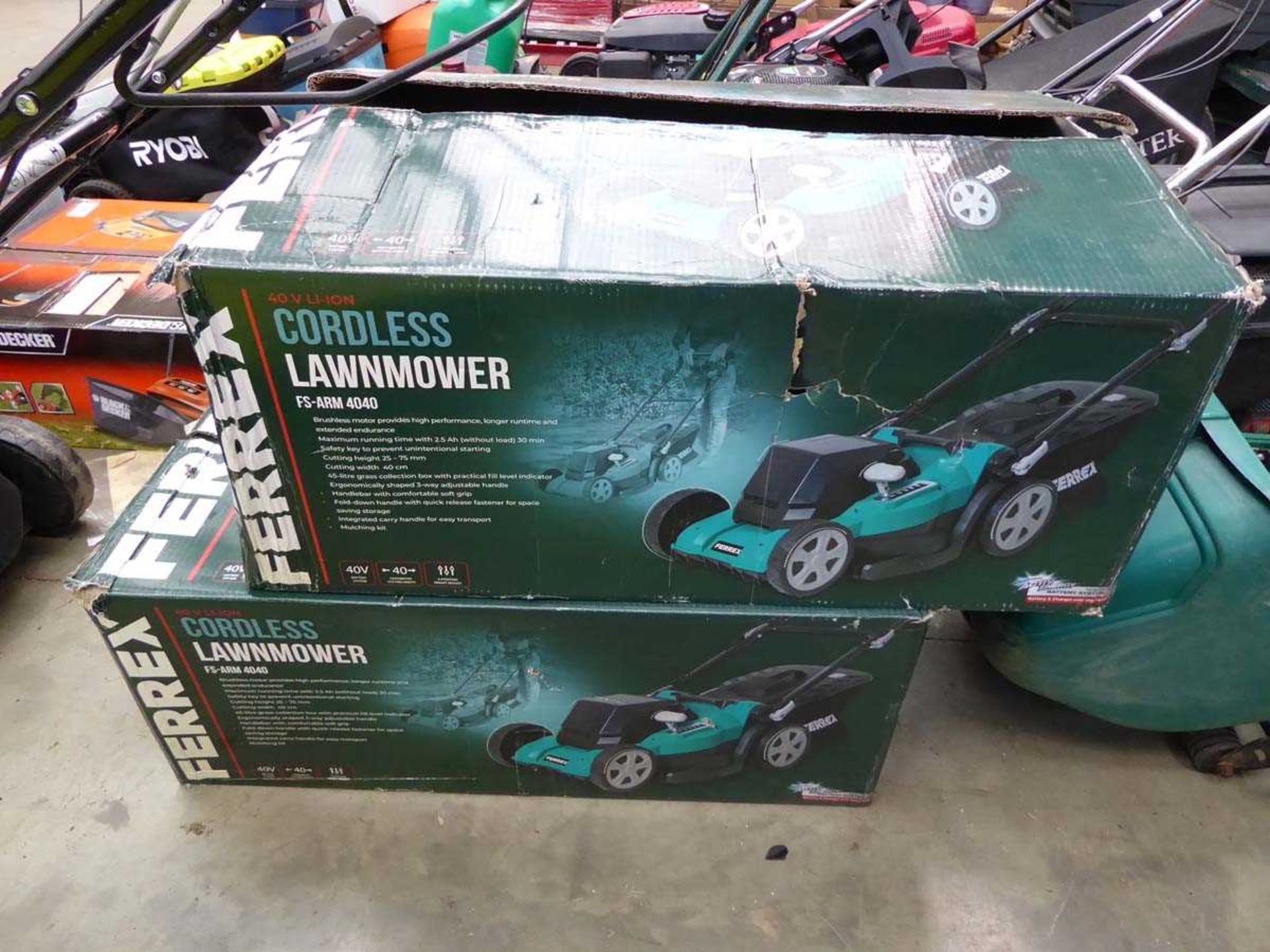 Two boxed Ferrex electric lawnmowers, one has no grass box and both have no batteries