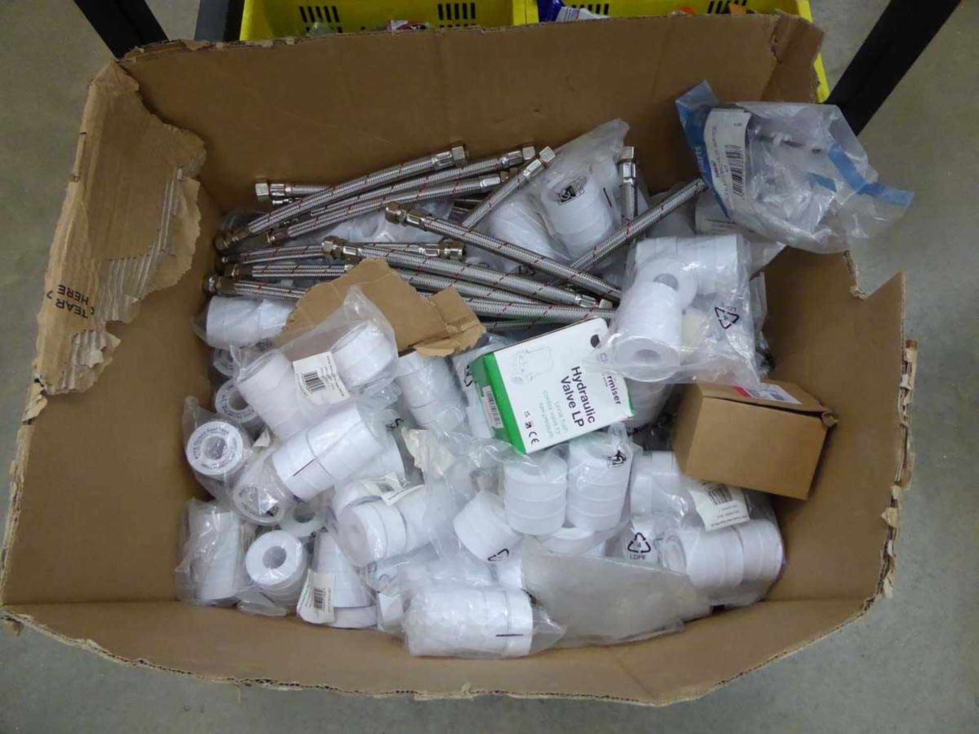 Box of plumbing items including hydraulic file, PTFE tape, pipes, etc