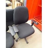 Black cloth swivel armchair