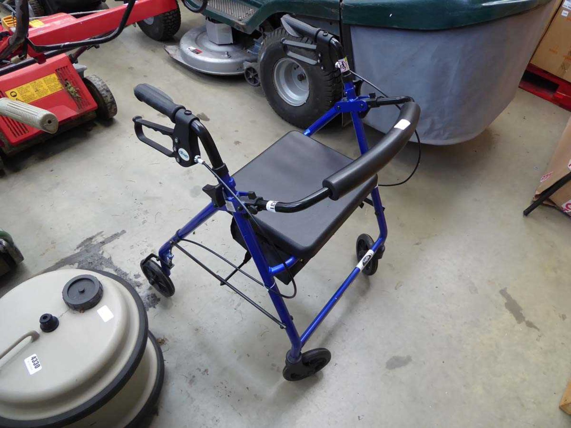 Four wheeled disability walking aid