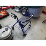 Four wheeled disability walking aid