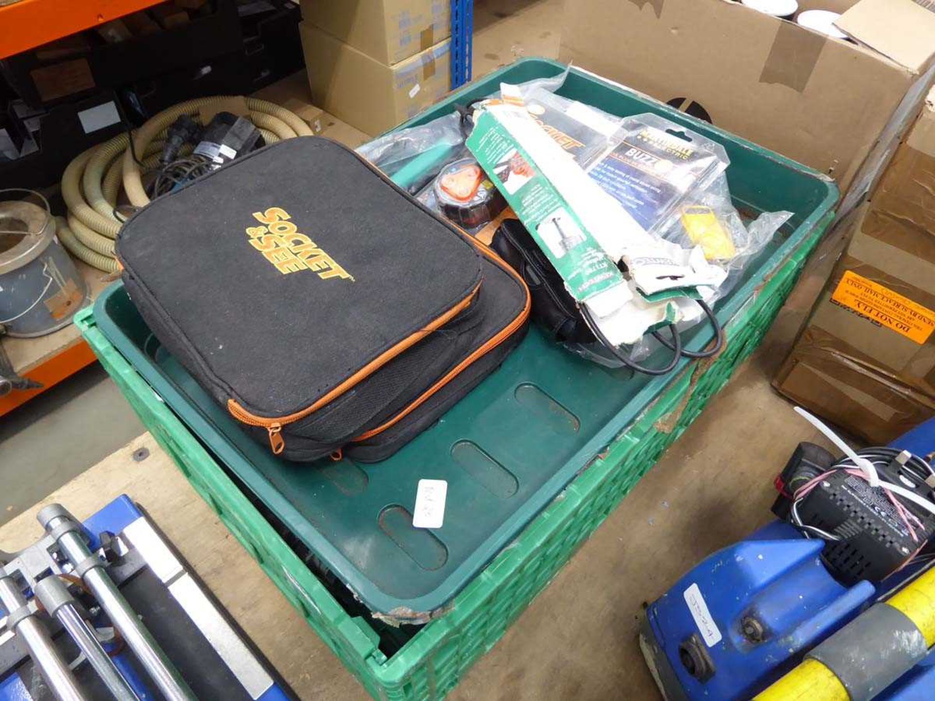 Plastic crate containing power tools and electrical testers