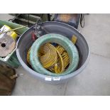 Grey bucket containing lay flat hose and sub pump