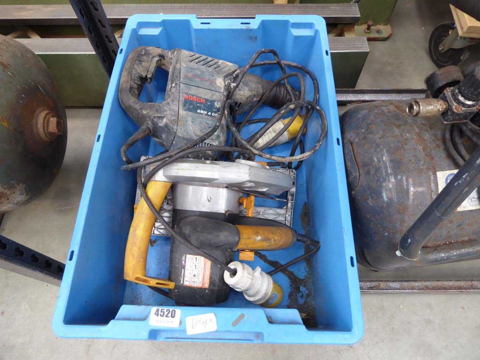 Blue crate containing Bosch GBH4DFE 110v breaker and a circular saw