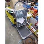 Four wheeled fold up trolley and a small step ladder
