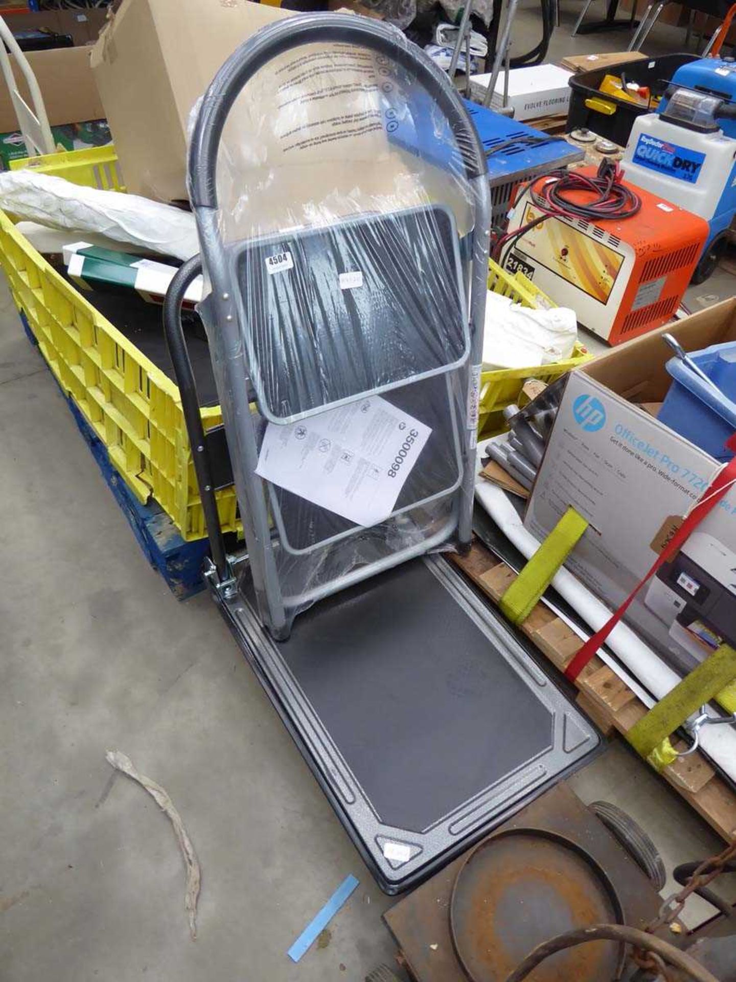 Four wheeled fold up trolley and a small step ladder