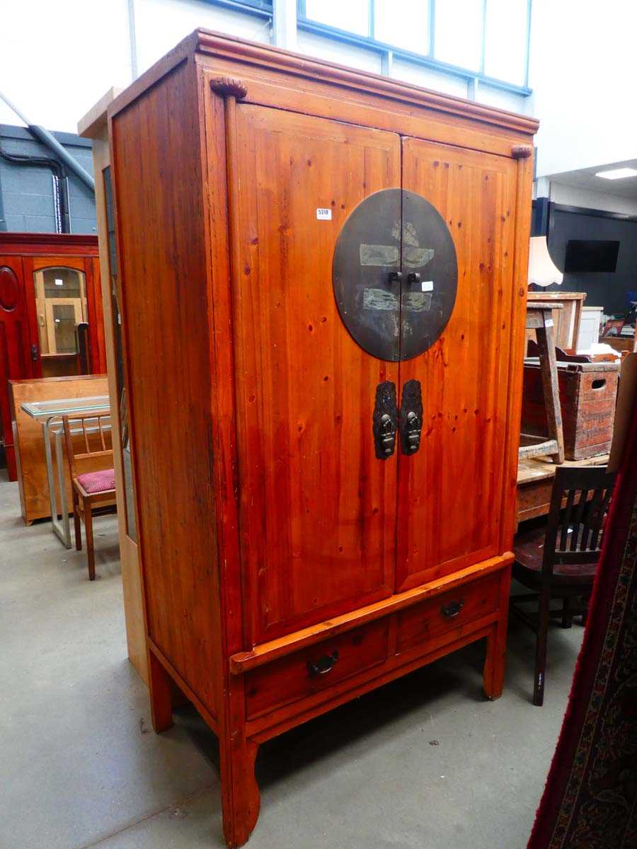 Oriental inspired double door cupboard with drawers under