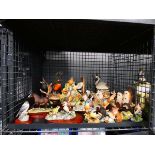 Cage of ornamental resin animal figures