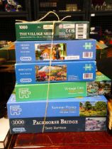 Stack of Gibson and other jigsaw puzzles