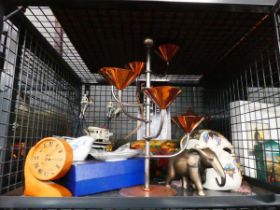 Cage containing ornamental elephant, ornamental fishing boat, candle holder and jewellery box