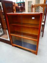 Oak bookcase with glazed sliding doors
