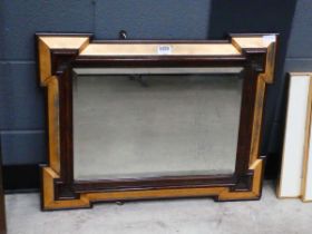 Bevelled mirror in walnut and gilt frame