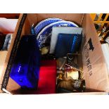 Box containing blue and white crockery, candlesticks, egg cups, glassware and brass goblets