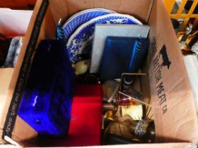 Box containing blue and white crockery, candlesticks, egg cups, glassware and brass goblets