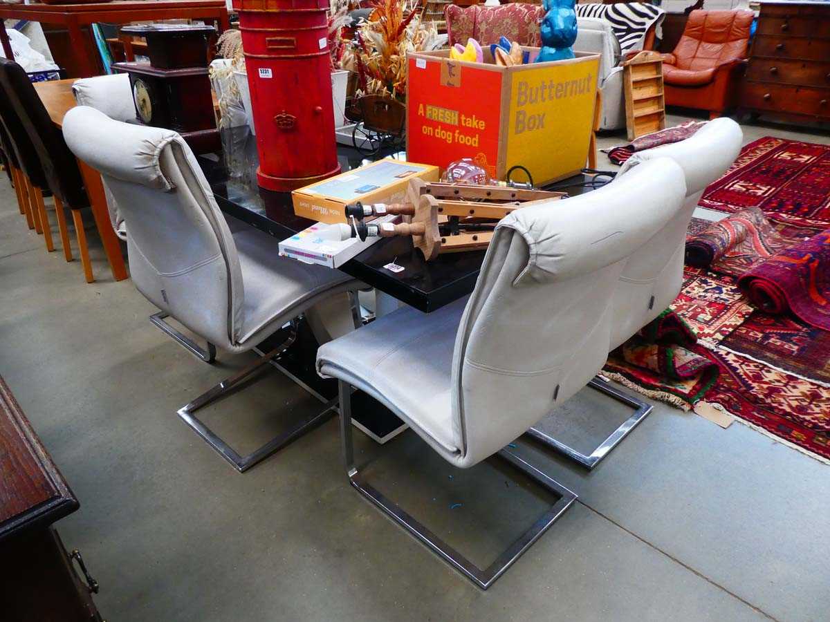 Black painted dining table, plus six leather effect dining chairs