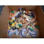 Box containing a quantity of ceramic flying ducks and other birds