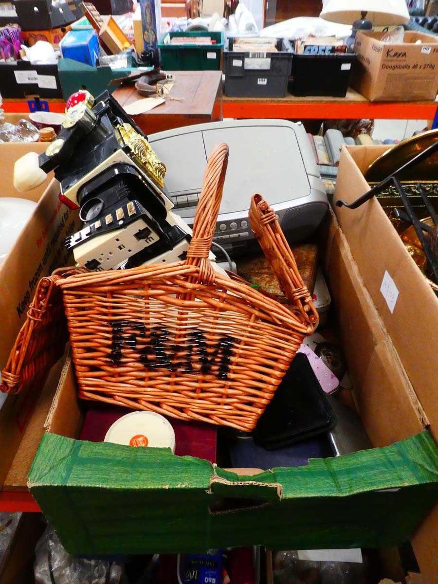 Box containing loose cutlery, radio, books and wicker basket