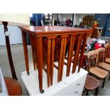 Teak table with four folding tables nesting under