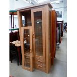 Glazed oak double door display unit with drawers under