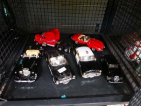 Cage containing quantity of Burago cars