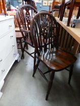 Six oak wheel back dining chairs