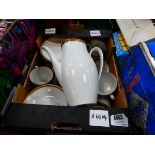 Box containing gold rimmed crockery