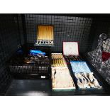 Cage of loose cutlery and boxed cutlery sets