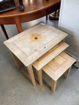 Nest of 3 lime washed tables