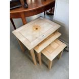 Nest of 3 lime washed tables