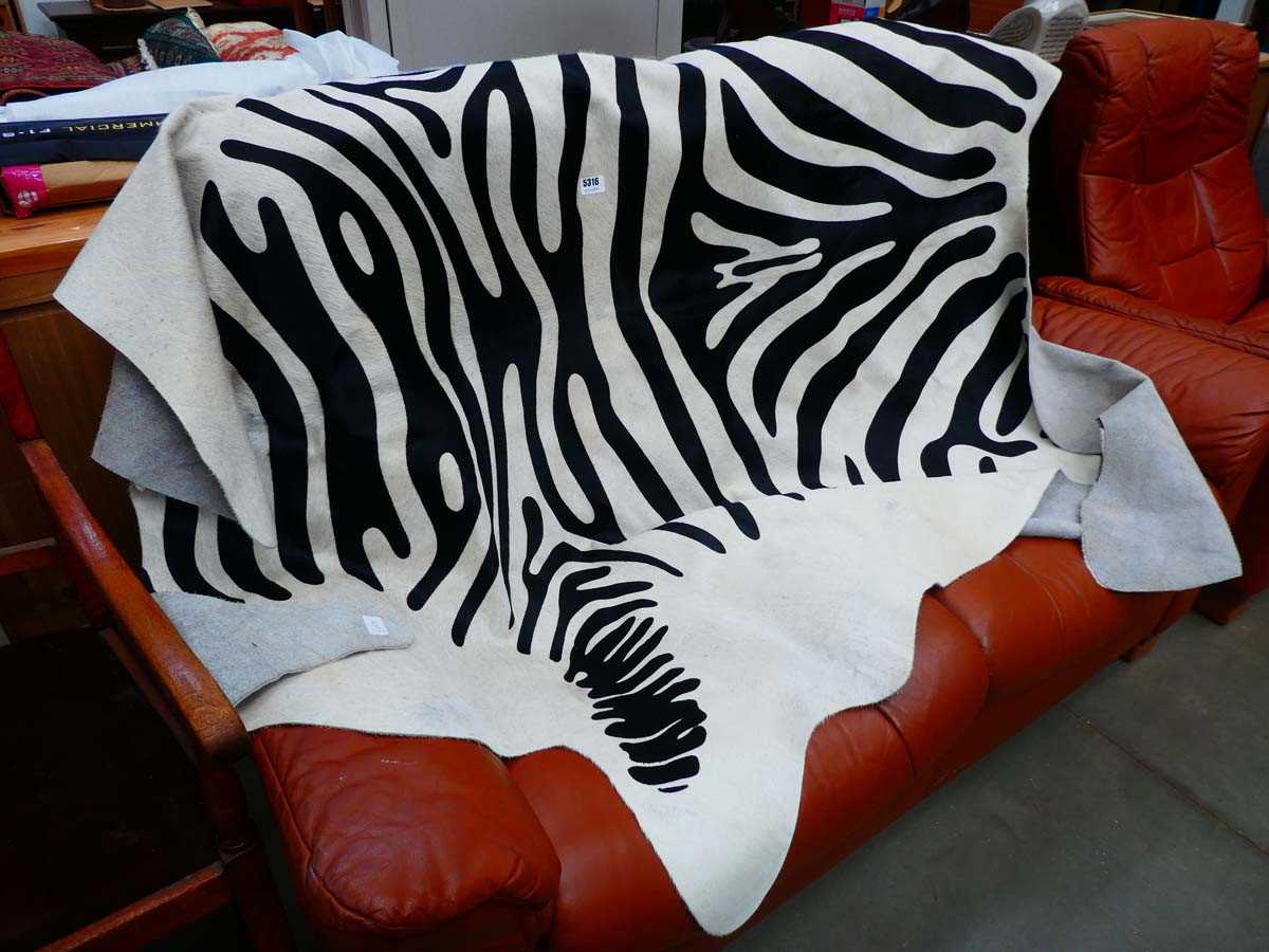 Cows hide with over painted zebra stripe