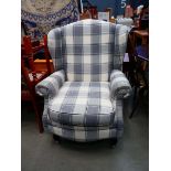 Grey and beige wingback armchair