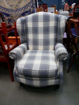 Grey and beige wingback armchair