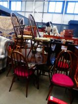 Ercol dropside dining table plus eight dining chairs to include two carvers