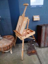 Folding artists easel with attached paint box