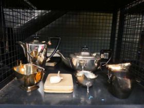 Cage of cutlery sets, teapots, sugar bowls, jugs and a pipe