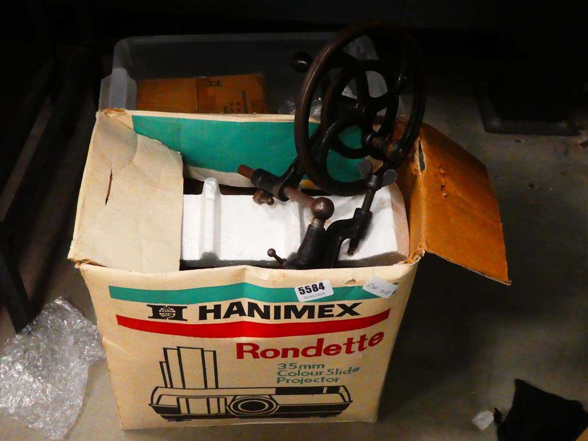 Box containing slide projector and desk mounted fly wheel