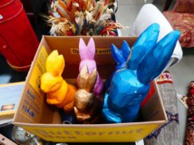 Box containing 5 painted plaster bunnies