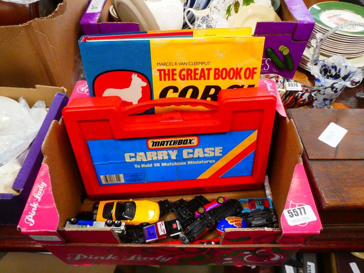 Box containing die cast cars and Corgi book