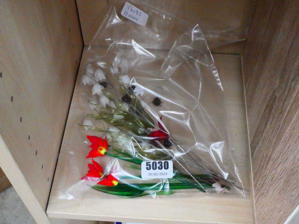 Bag containing Murano glass flowers