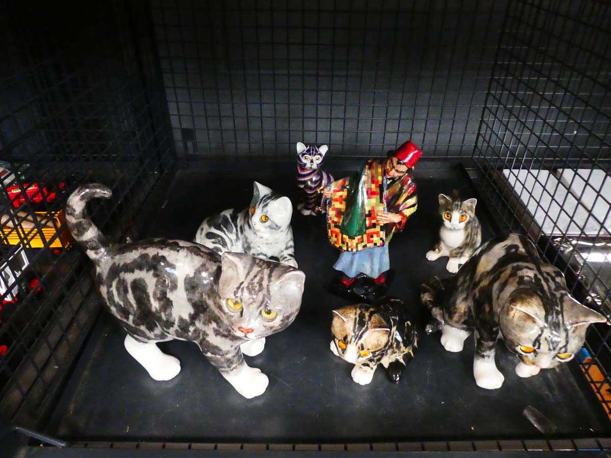 Cage of Winstanley cats plus Royal Doulton figure of carpet seller