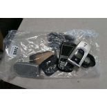 Bag containing flip phones and others