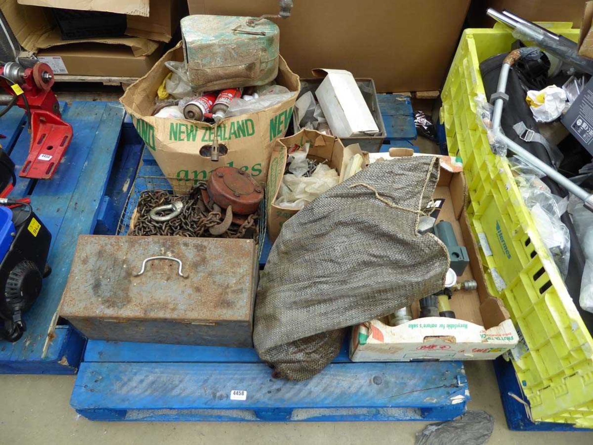 Pallet of assorted items including chain block, nails, sand paper, etc