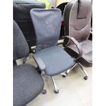 Mesh office operators chair on grey base